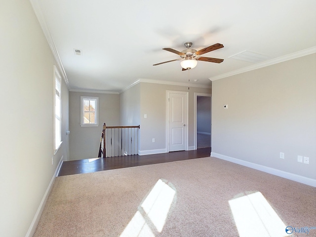 empty room with ceiling fan, dark hardwood / wood-style flooring, and crown molding