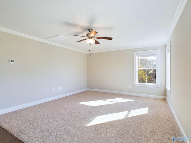 spare room with light carpet, ceiling fan, and ornamental molding