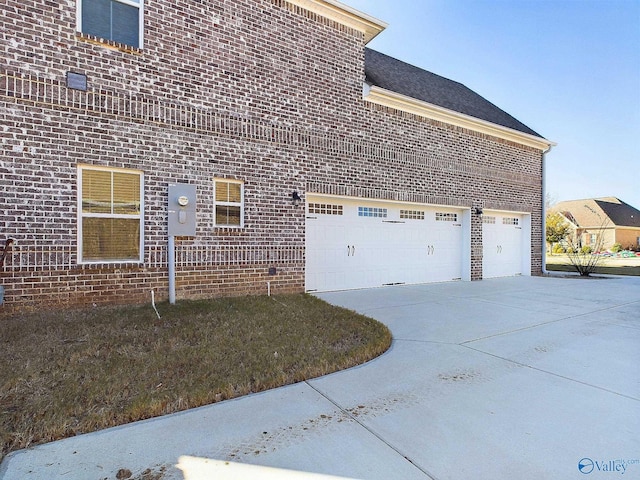 view of side of property featuring a garage