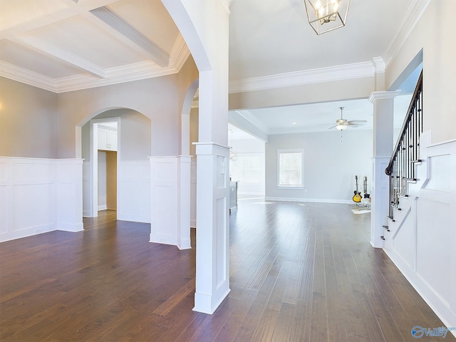 foyer entrance with ceiling fan with notable chandelier, crown molding, dark hardwood / wood-style floors, ornate columns, and beamed ceiling