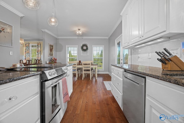 2961 Hobbs Island Rd SE, Huntsville, AL 35803 - kitchen featuring ornamental molding, dark wood-type flooring, white cabinets, appliances with stainless steel finishes, and backsplash