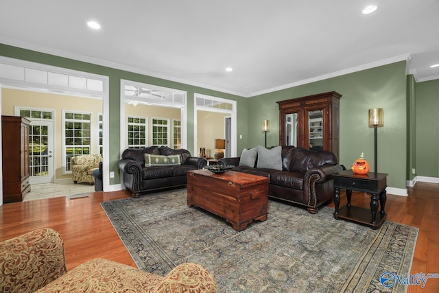 living room featuring ornamental molding and hardwood / wood-style floors