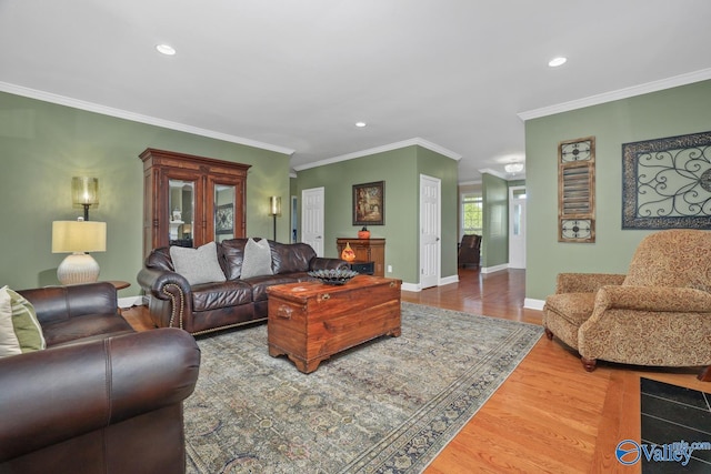 living room featuring ornamental molding and wood-type flooring