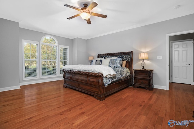 2961 Hobbs Island Rd SE, Huntsville, AL 35803 - bedroom featuring baseboards, ornamental molding, a ceiling fan, and wood finished floors