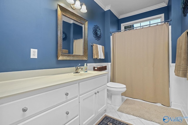 bathroom with toilet, vanity, tile patterned flooring, and ornamental molding