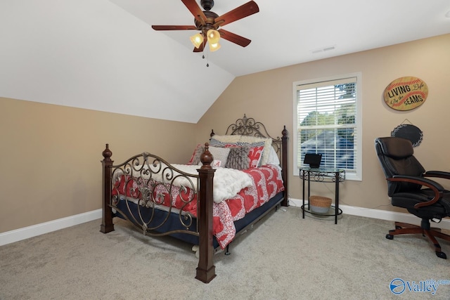 bedroom featuring light carpet, vaulted ceiling, and ceiling fan