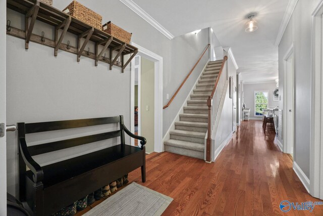 2961 Hobbs Island Rd SE, Huntsville, AL 35803 - stairway featuring baseboards, ornamental molding, and wood finished floors