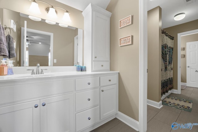 2961 Hobbs Island Rd SE, Huntsville, AL 35803 - full bath with vanity, curtained shower, baseboards, tile patterned floors, and a ceiling fan