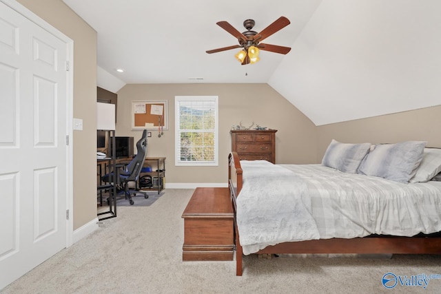 carpeted bedroom featuring vaulted ceiling and ceiling fan