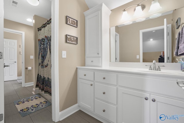 bathroom with tile patterned floors, vanity, and a shower with curtain