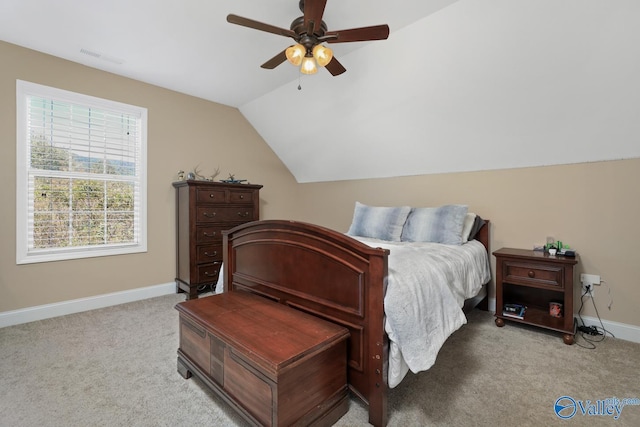 2961 Hobbs Island Rd SE, Huntsville, AL 35803 - bedroom featuring baseboards, light colored carpet, ceiling fan, and vaulted ceiling