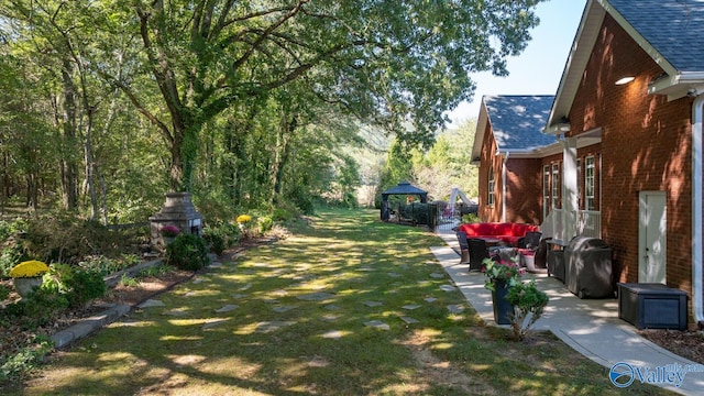 view of yard with a patio and a gazebo