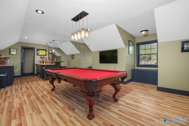 recreation room featuring light hardwood / wood-style flooring, pool table, bar, and lofted ceiling