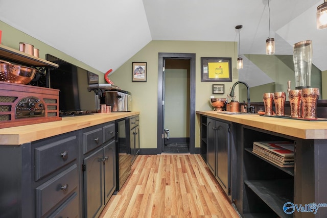 2961 Hobbs Island Rd SE, Huntsville, AL 35803 - kitchen featuring a sink, open shelves, wooden counters, and lofted ceiling