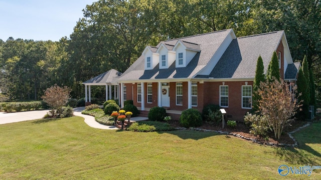 cape cod home featuring a front yard and a porch