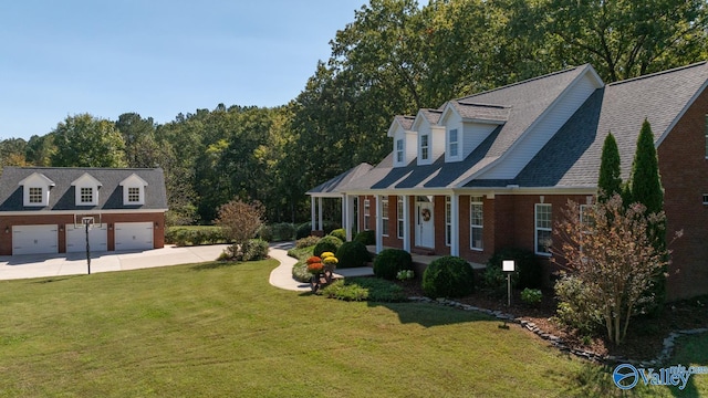 cape cod house with a porch, a garage, and a front yard