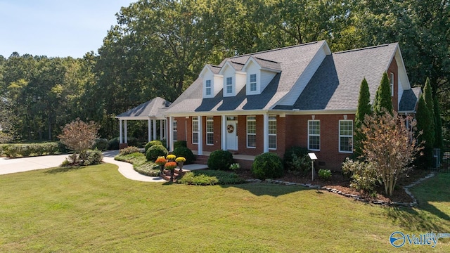 2961 Hobbs Island Rd SE, Huntsville, AL 35803 - new england style home with a porch, brick siding, and a front lawn