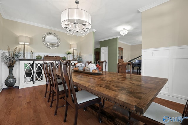 dining space with a notable chandelier, dark hardwood / wood-style flooring, and crown molding