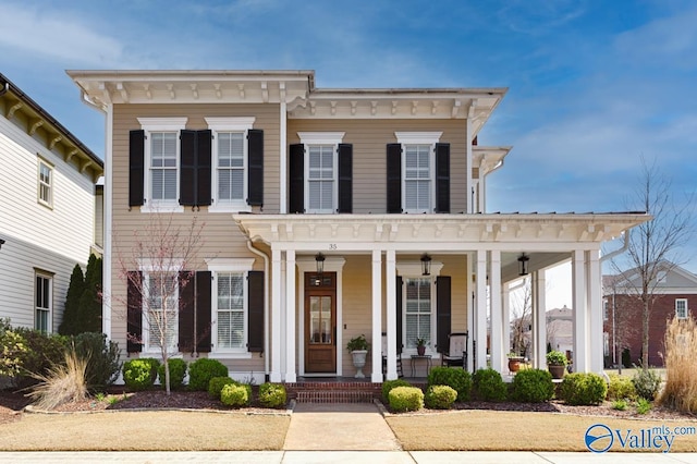 italianate house featuring covered porch