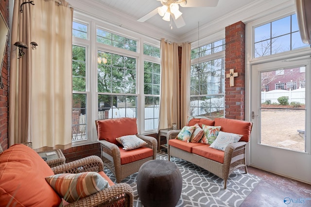 sunroom / solarium featuring a ceiling fan