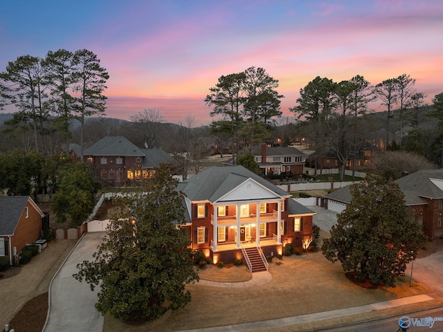 view of front of property featuring driveway and a residential view