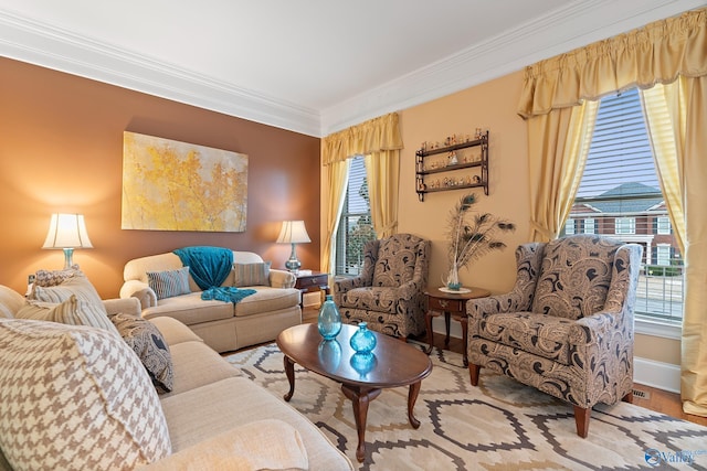 living room with visible vents, baseboards, and crown molding