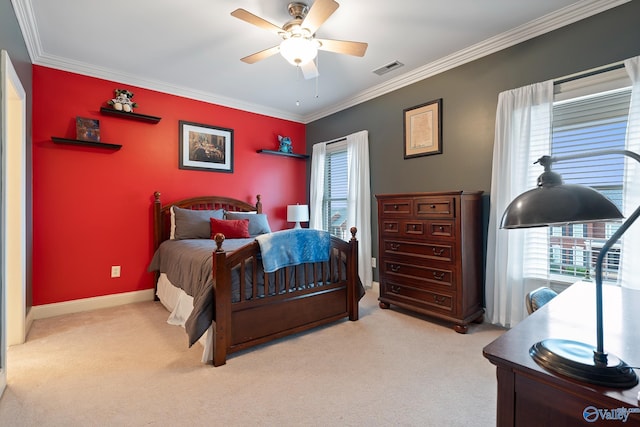 carpeted bedroom featuring baseboards, visible vents, a ceiling fan, and crown molding