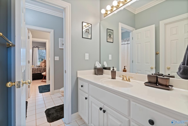 full bathroom with toilet, vanity, baseboards, tile patterned floors, and crown molding