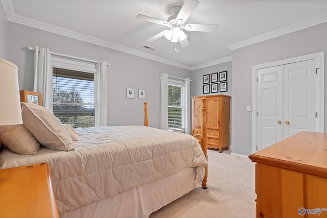 bedroom featuring light carpet, visible vents, baseboards, a ceiling fan, and ornamental molding