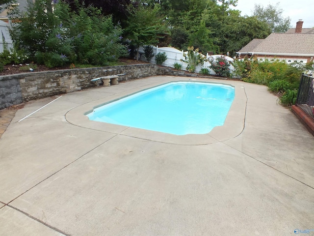 view of pool featuring a patio, fence, and a fenced in pool