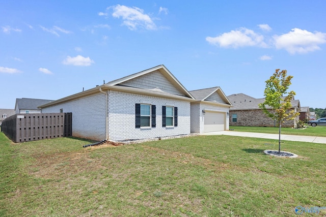 view of front of property with a front yard and a garage