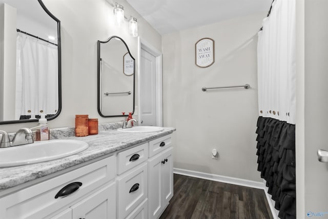 3559 County Road 1570, Baileyton, AL 35019 - full bath with double vanity, baseboards, a sink, and wood finished floors