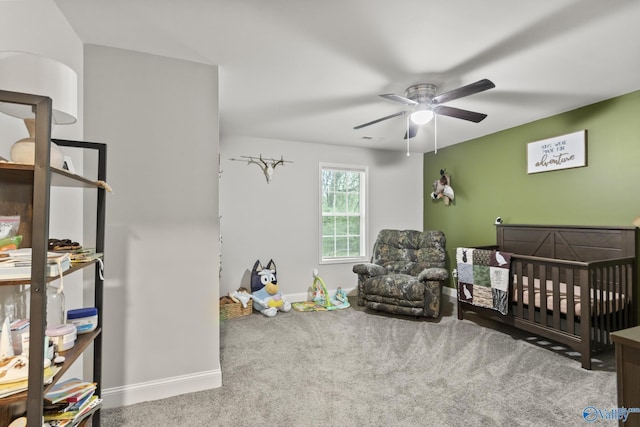 3559 County Road 1570, Baileyton, AL 35019 - carpeted bedroom with baseboards, a ceiling fan, and a crib