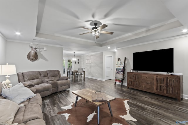 3559 County Road 1570, Baileyton, AL 35019 - living area featuring dark wood-type flooring, a tray ceiling, baseboards, and ceiling fan with notable chandelier