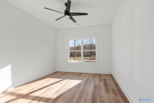 empty room with ceiling fan and light wood-type flooring