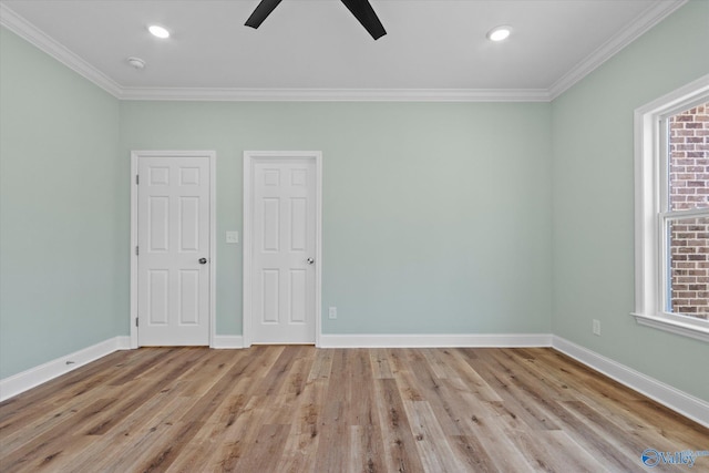 spare room featuring light hardwood / wood-style floors, ceiling fan, and ornamental molding