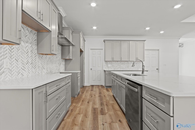 kitchen with stainless steel dishwasher, gray cabinetry, ornamental molding, and sink