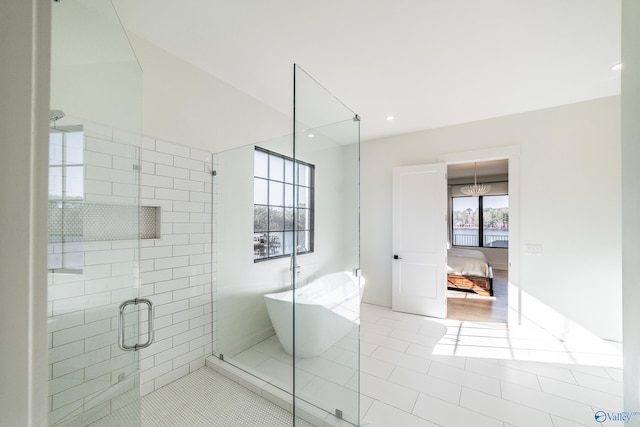 bathroom featuring shower with separate bathtub and tile patterned floors