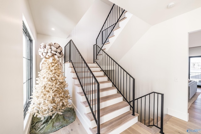 stairway featuring hardwood / wood-style floors