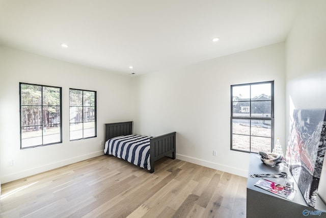 bedroom with light hardwood / wood-style flooring