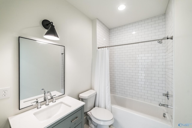 full bathroom featuring shower / bath combo with shower curtain, vanity, and toilet