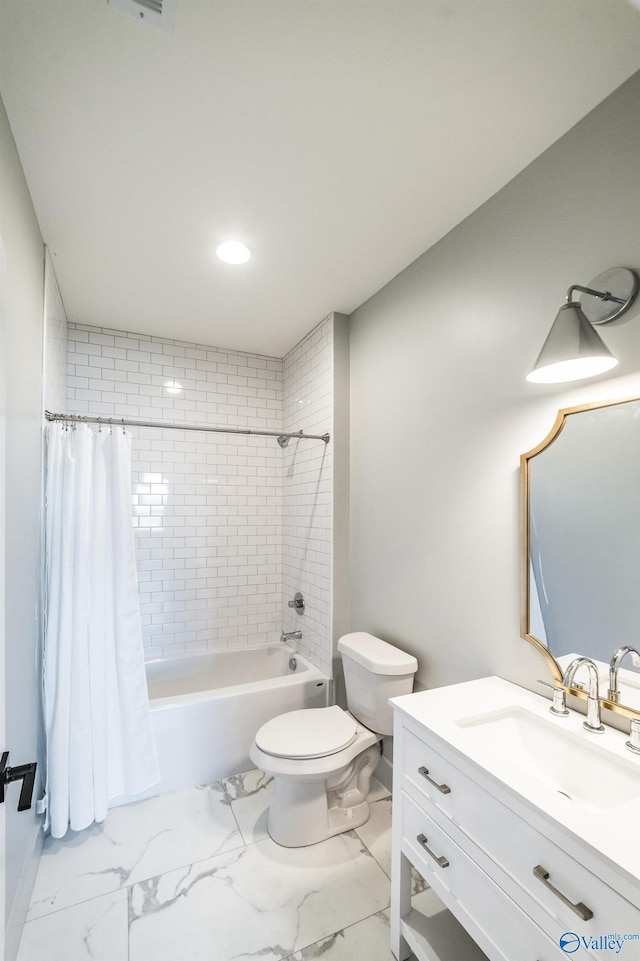 full bathroom featuring shower / bath combo, toilet, and vanity