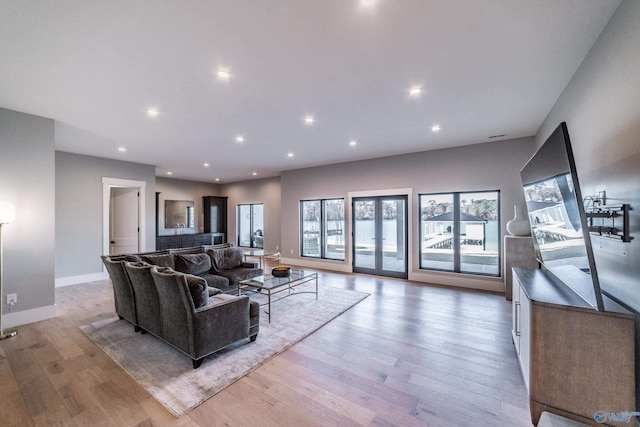 living room with light hardwood / wood-style floors