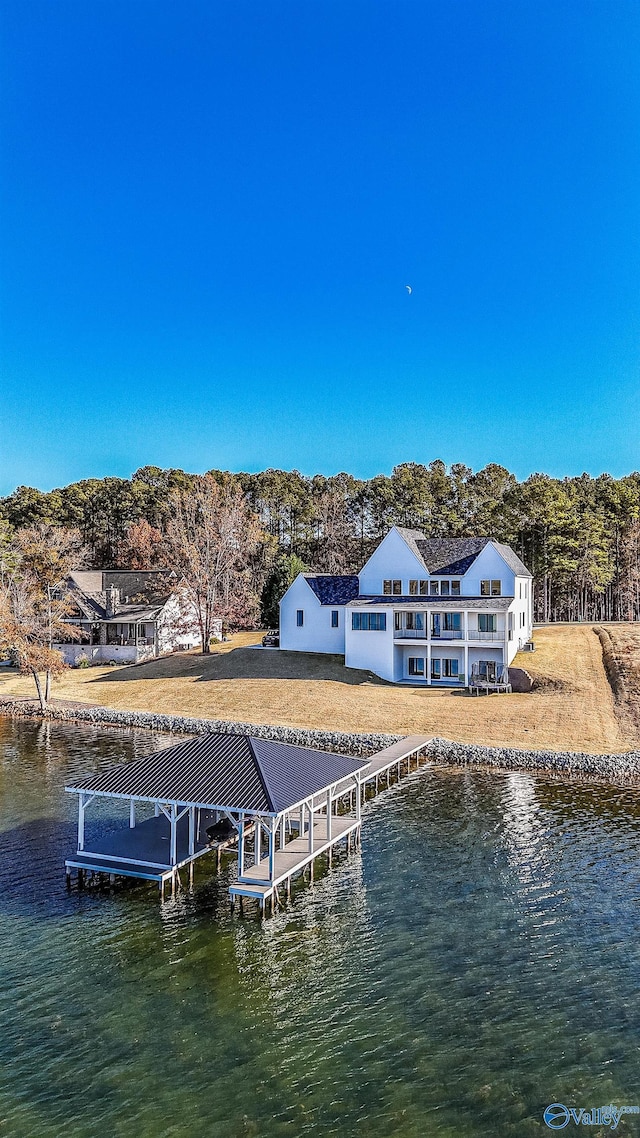 view of dock with a water view and a balcony