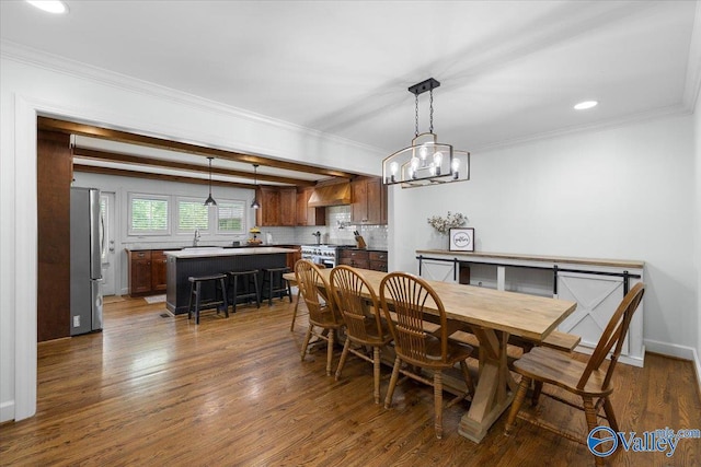 dining area with recessed lighting, ornamental molding, a chandelier, and dark wood-style floors