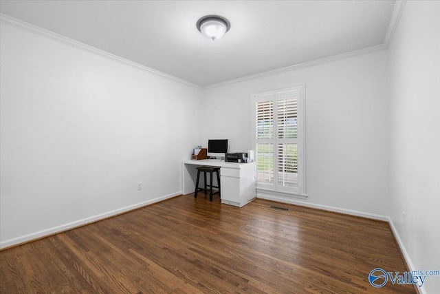 unfurnished office featuring baseboards, ornamental molding, wood finished floors, and visible vents