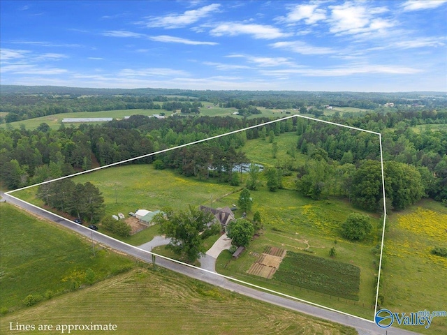 birds eye view of property with a forest view