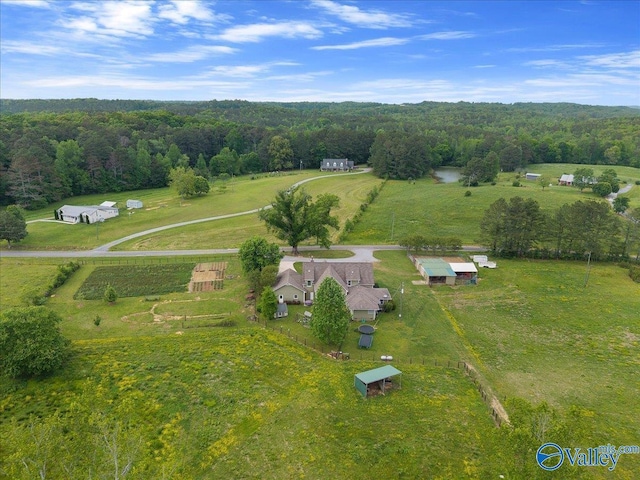 aerial view featuring a rural view and a wooded view