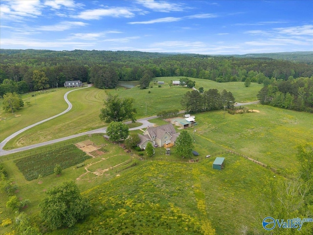 bird's eye view featuring a rural view and a wooded view
