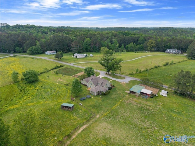 aerial view featuring a view of trees and a rural view